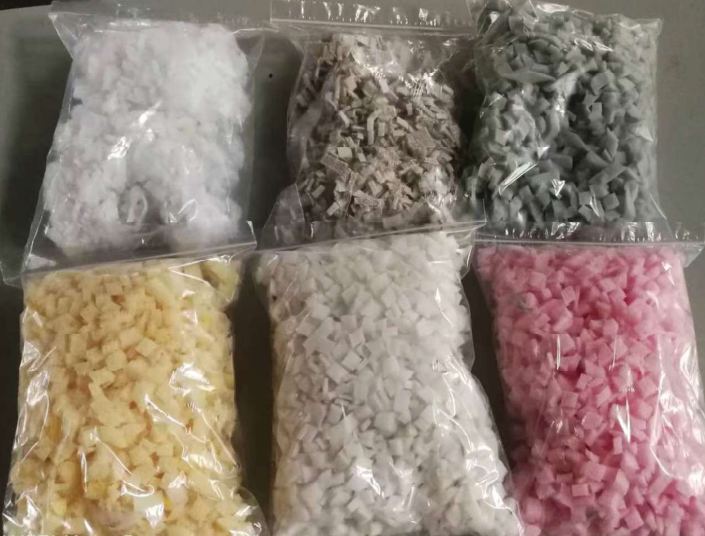 Bags of processed foam chips in different colours